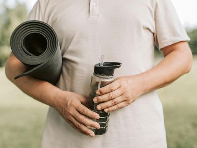 Close-up of a yoga mat and a water bottle.
